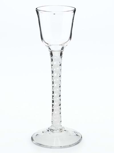 A wine glass with an extended stem