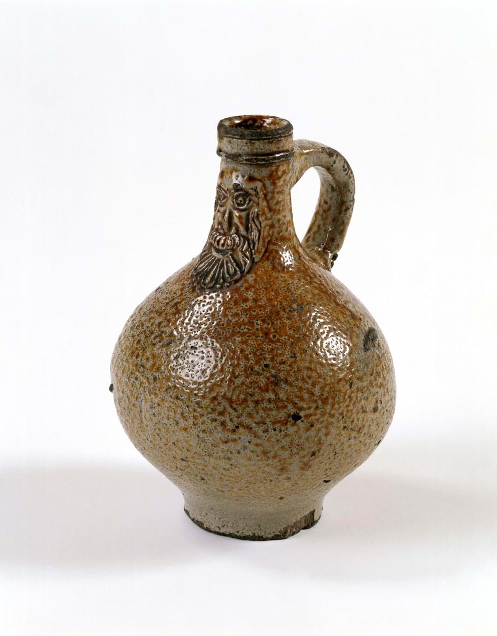 Brown jug with engraving of a face