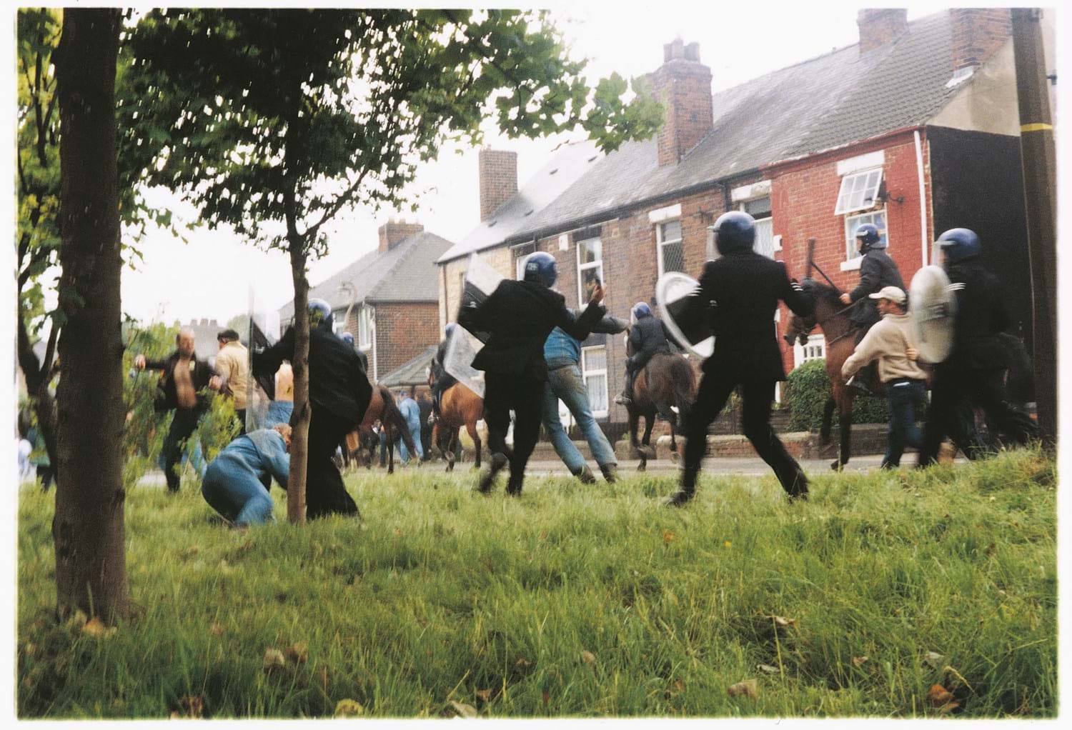 Photograph still from artist Jeremy Deller's The Battle of Orgreave (An Injury to One is an Injury to All) depicting clashes between police and protestors