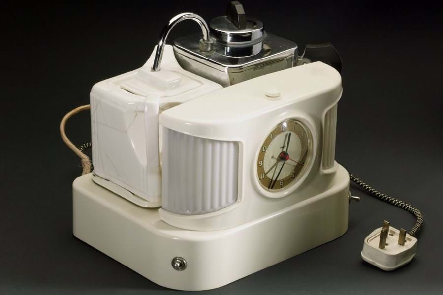 Cream plastic machine with alarm clock and function for making tea 
