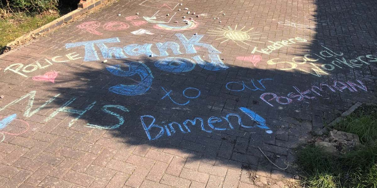 Colourful chalk writing thanking NHS, police and other key workers