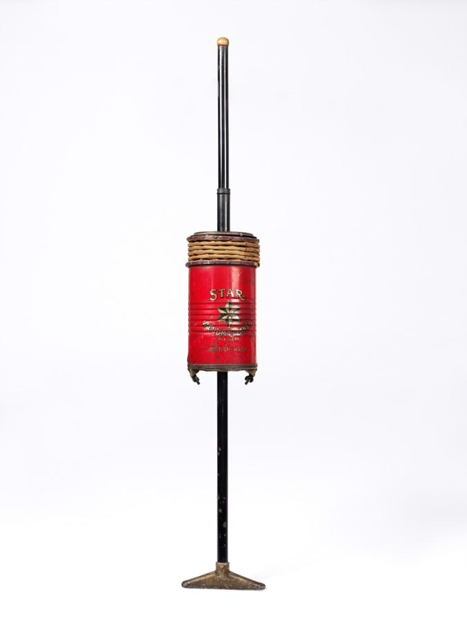 A metal vaccum cleaner painted red