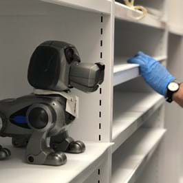 A toy robot dog on the shelves of the museum stores