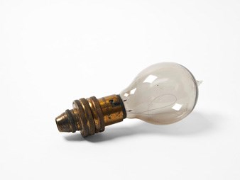 Lightbulb laying on flat white background