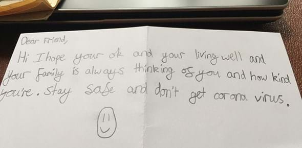 A note that reads 'Dear Friend, Hi I hope your ok and your living well your family is always thinking of you and you're stay safe and don't get corona'