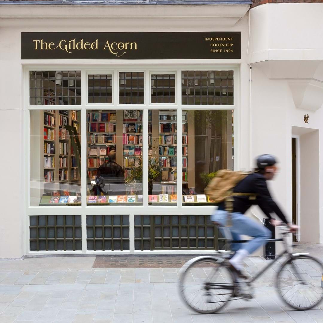 A bookstore in London with a cyclist passing by