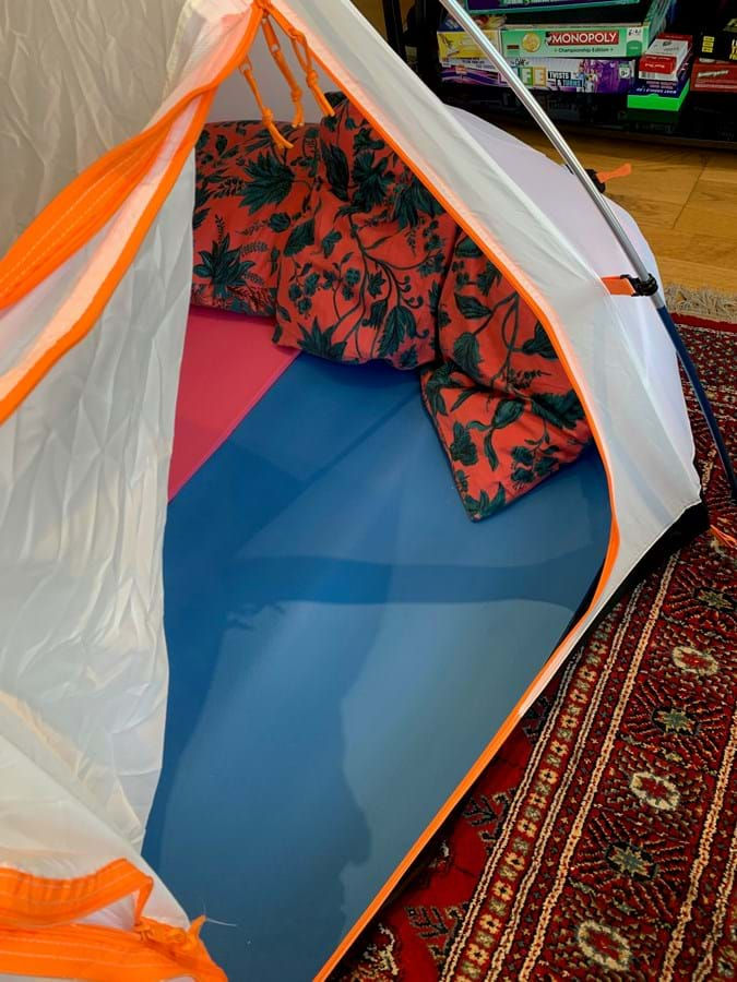 A tent pitched indoors