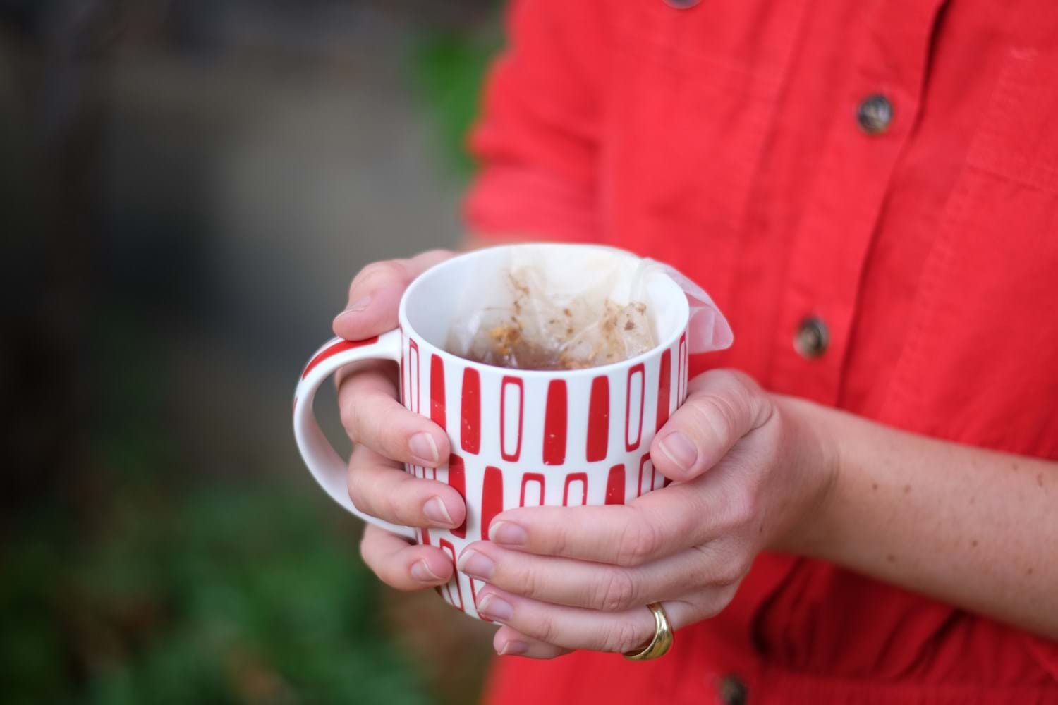 holding a mug of tea