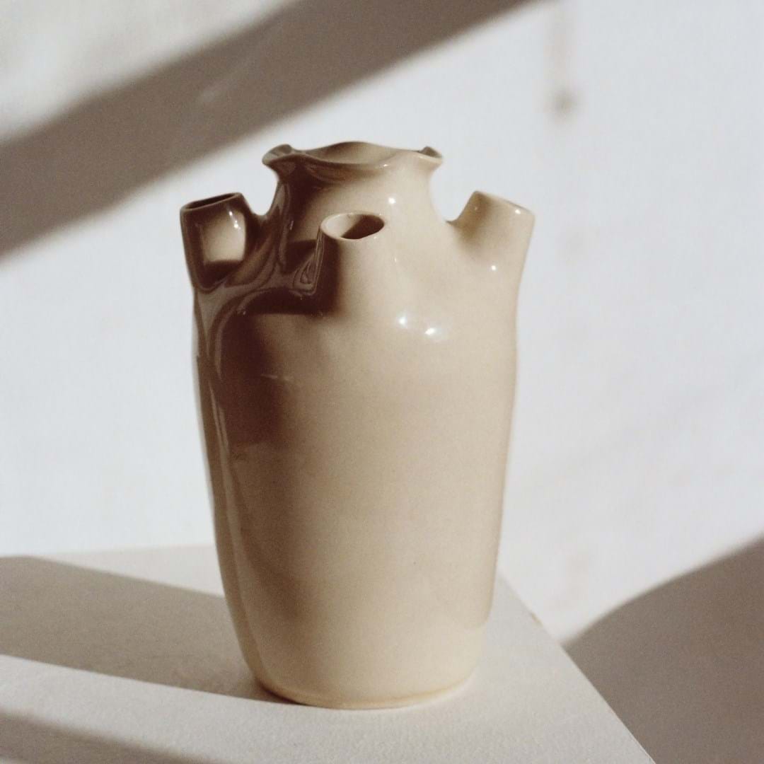 An off white ceramic pot 