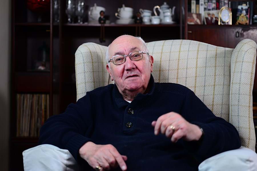 A person sitting in an armchair