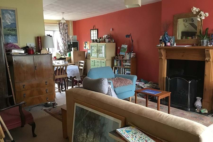 A living room with sofa and other items of furniture