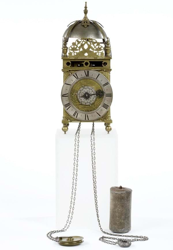 An ornate silver and gold clock