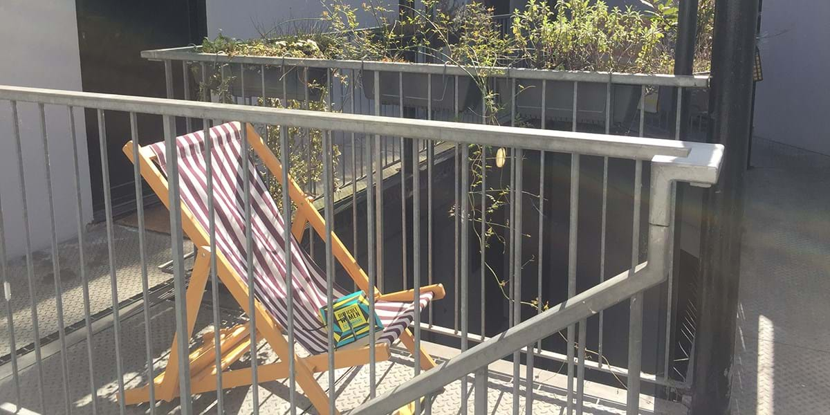 Red and white stripey deckchair on a private balcony