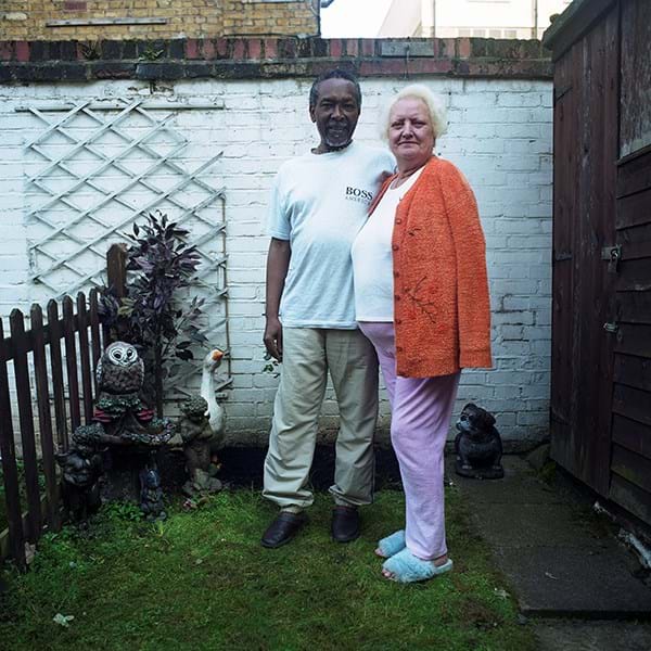 A couple standing in their garden