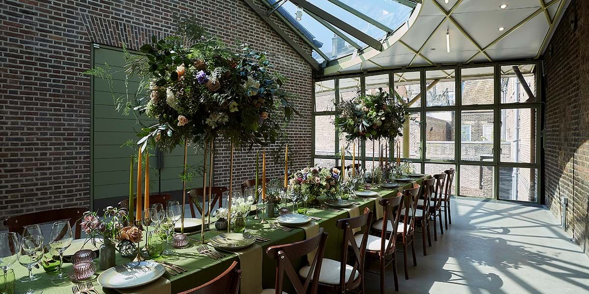 A long table dressed for a wedding with flowers 