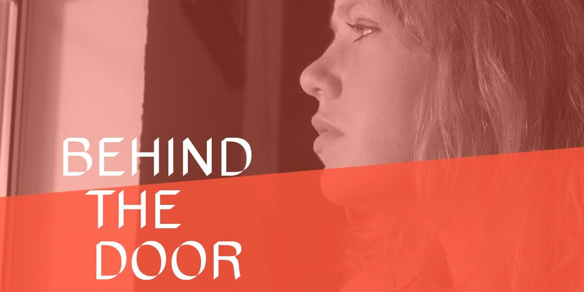 A person looking to the left, with text overlaid that reads 'behind the door'