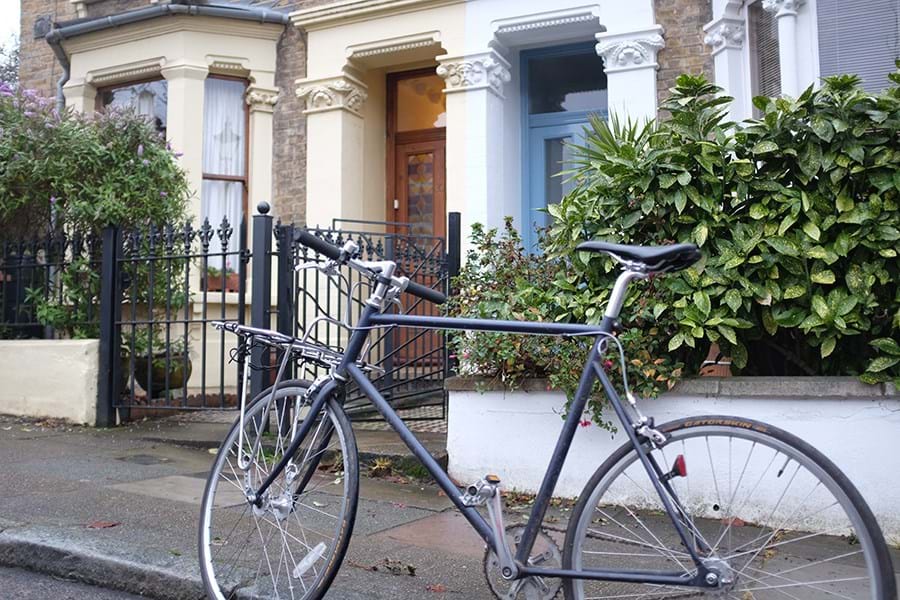A bike parked outside a Victorian terraced house