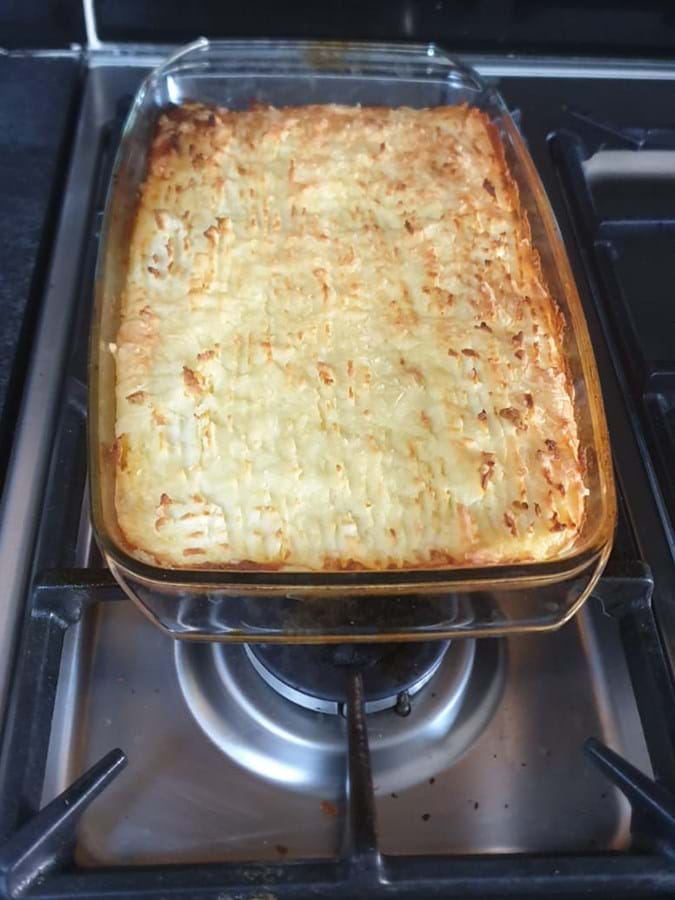 A glass oven dish filled with food