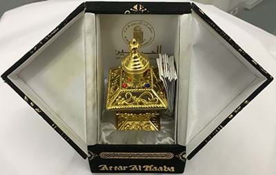 A gold perfume bottle