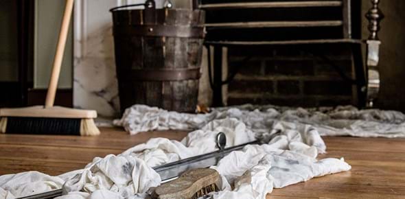 Tools for cleaning on a wooden fire in front of a fire place