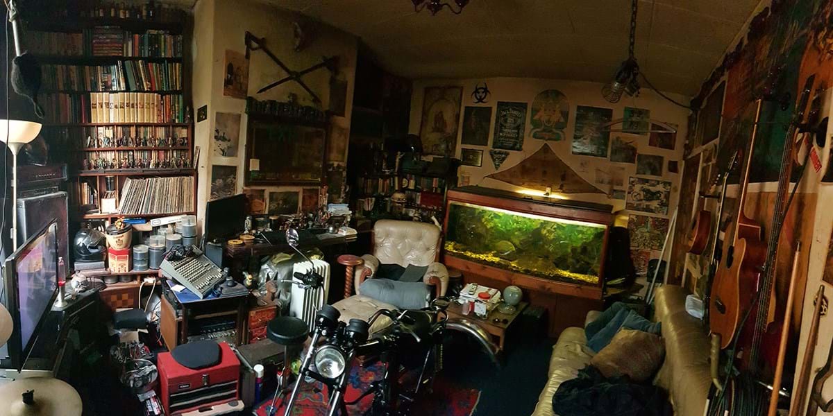 Living room with motorbike fish tank books and records