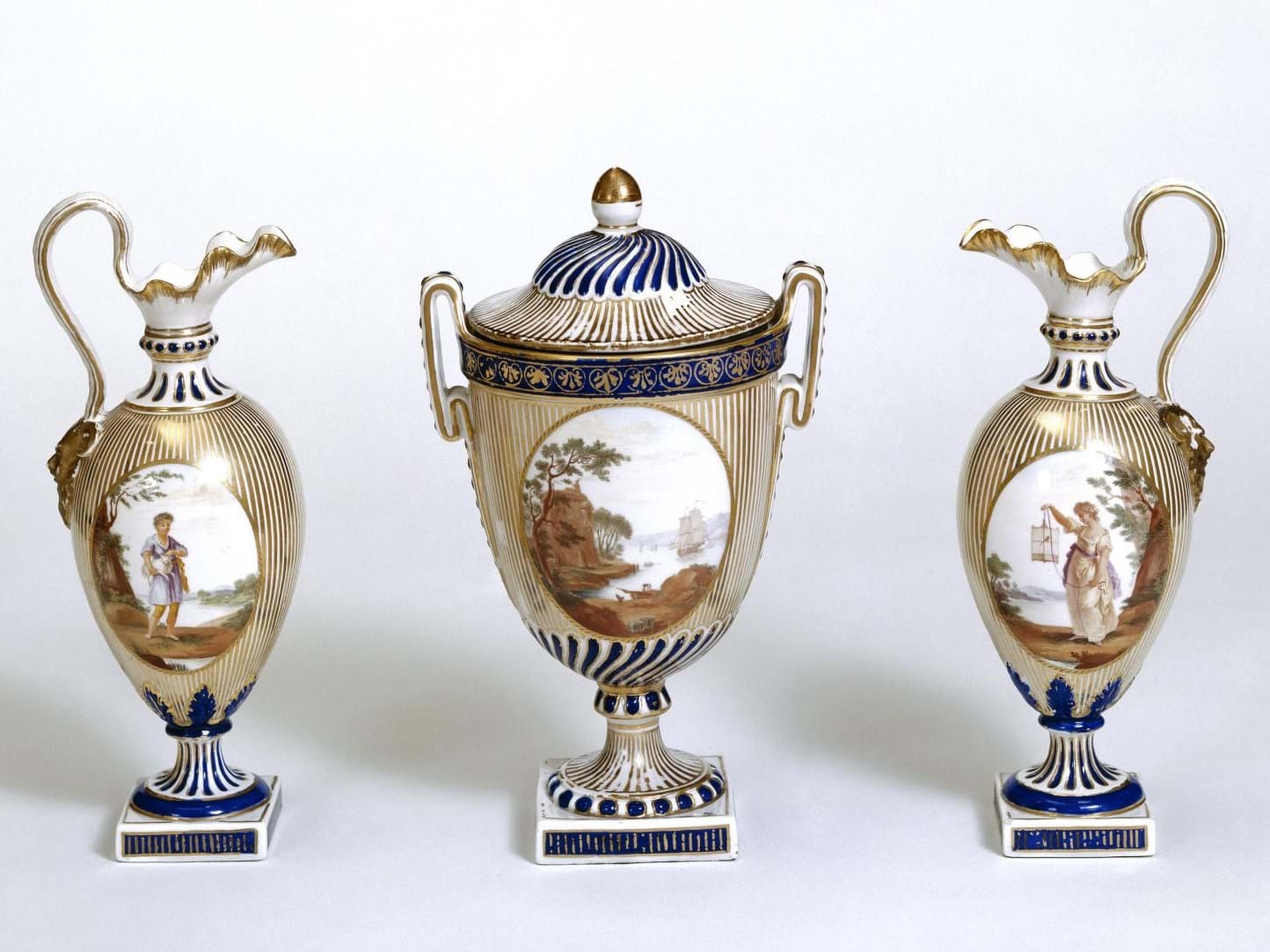 A matching set of jugs and a vase. 