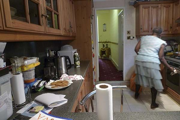 A woman in her kitchen preparing a meal