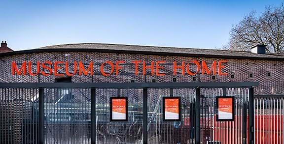 A brick building with orange lettering that reads 'Museum of the Home'