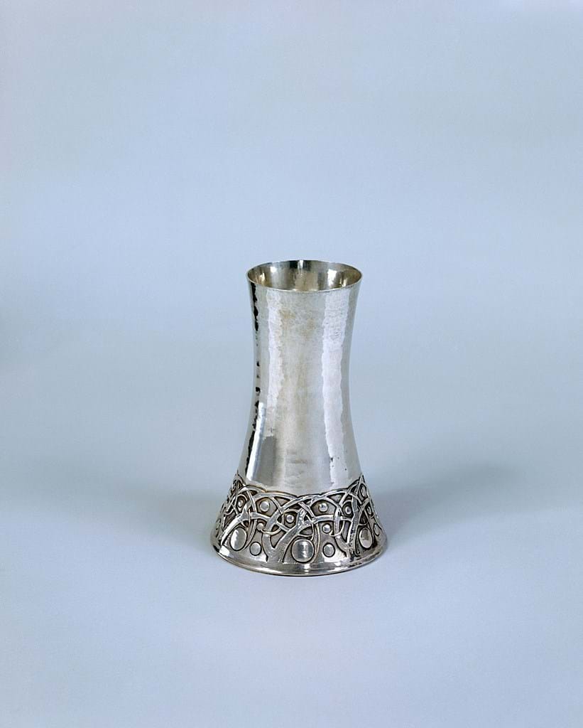 Silver vase with engraved detail at the base 