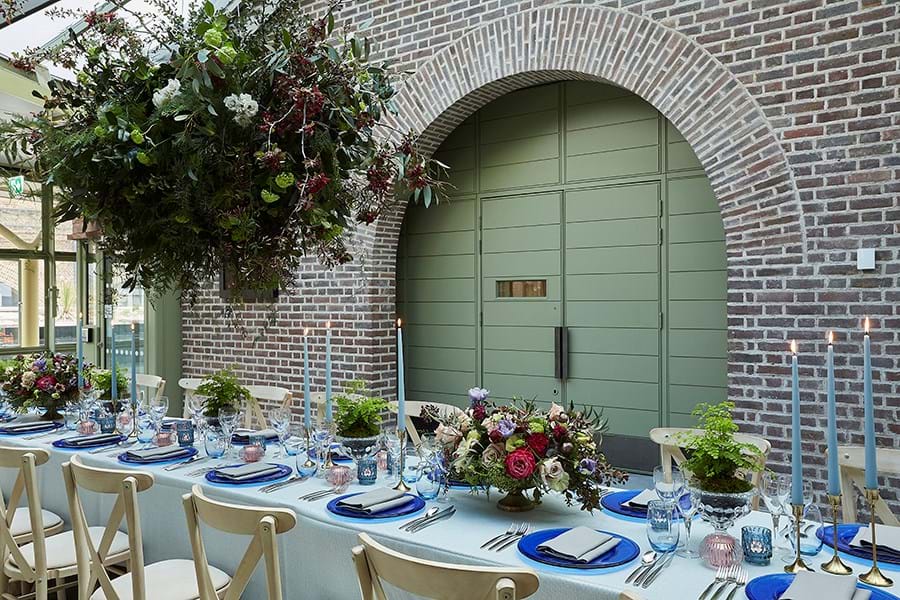 A table set for dinner with flowers and candles
