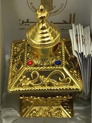 A gold perfume bottle