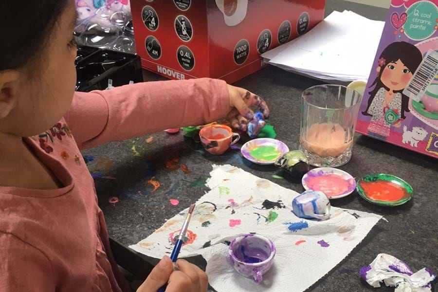 A child painting on a piece of paper