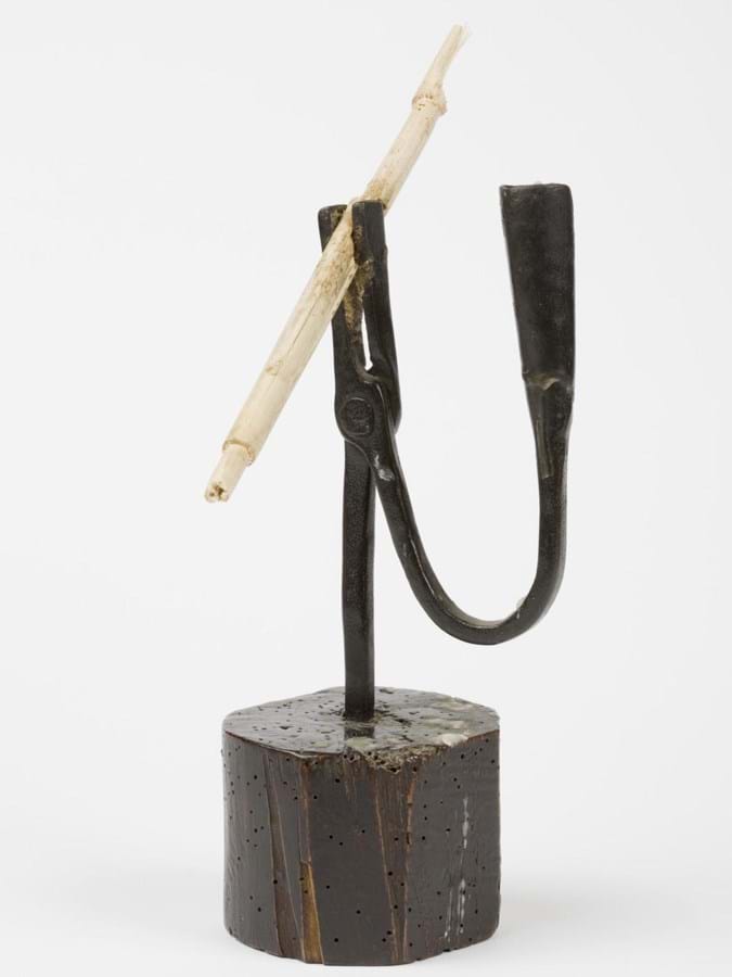 Rushlight holder made from iron with a wooden circular base