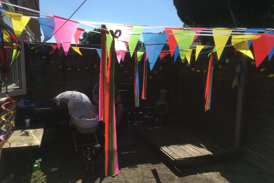 Colourful bunting hanging in a a garden