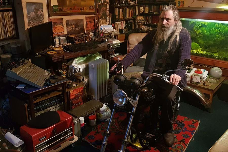 Person on motorbike in living room